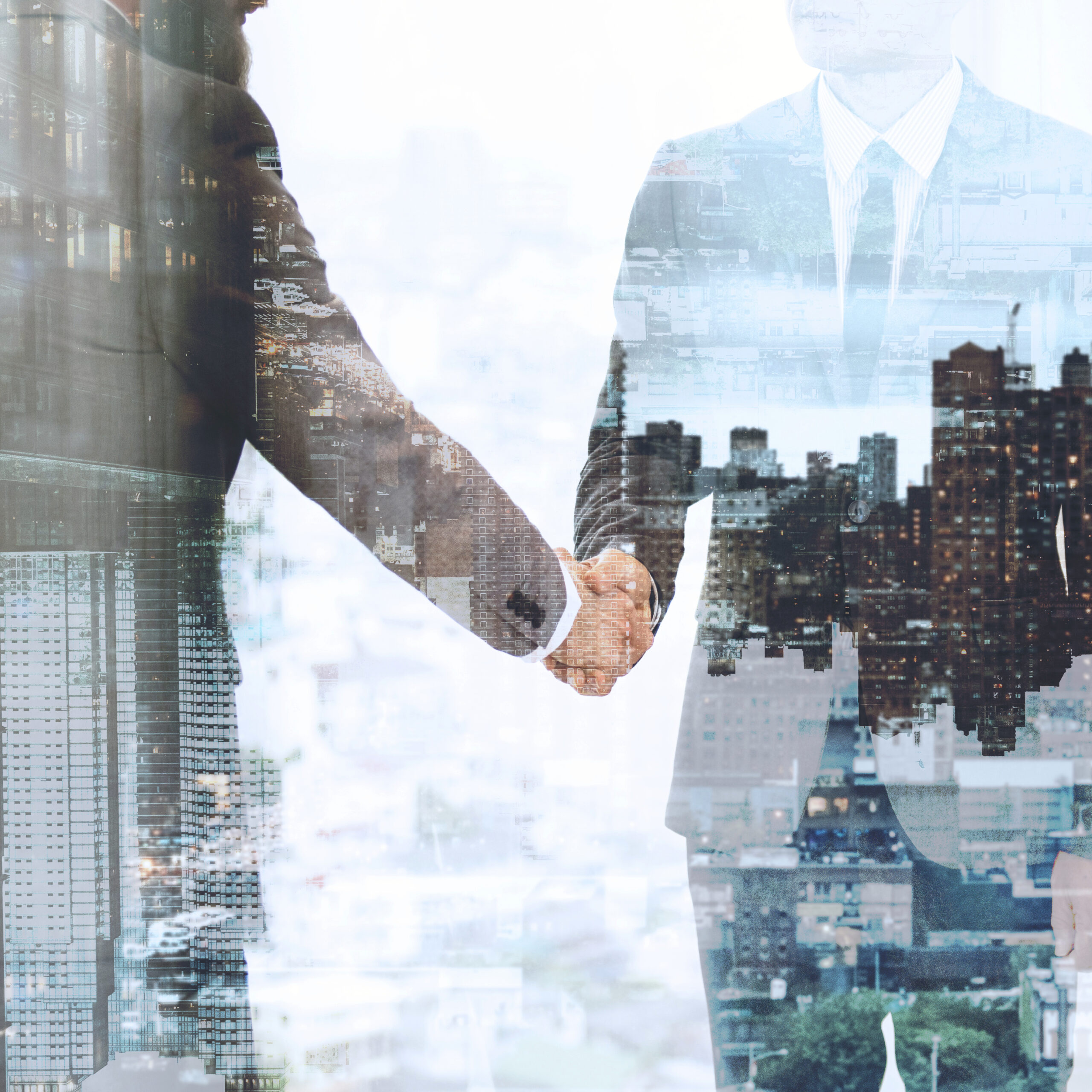 Corporate business handshake between business partners Corporate business handshake between business partners
